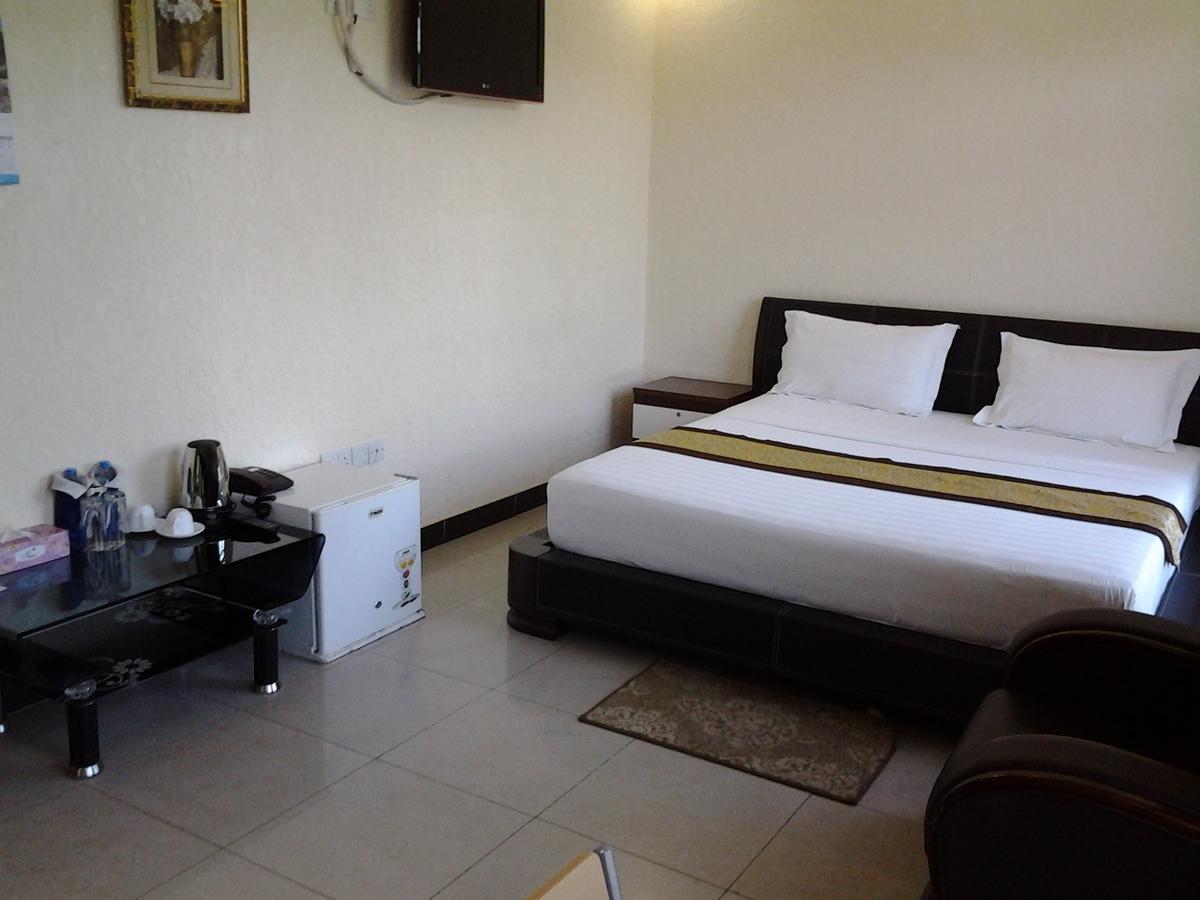 Best Point Hotel Dar es Salaam Quarto foto