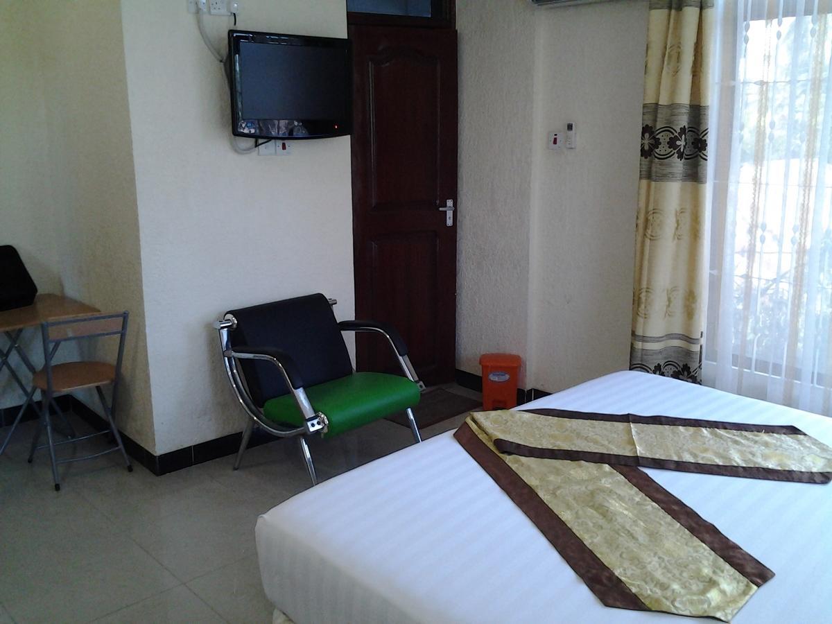 Best Point Hotel Dar es Salaam Quarto foto